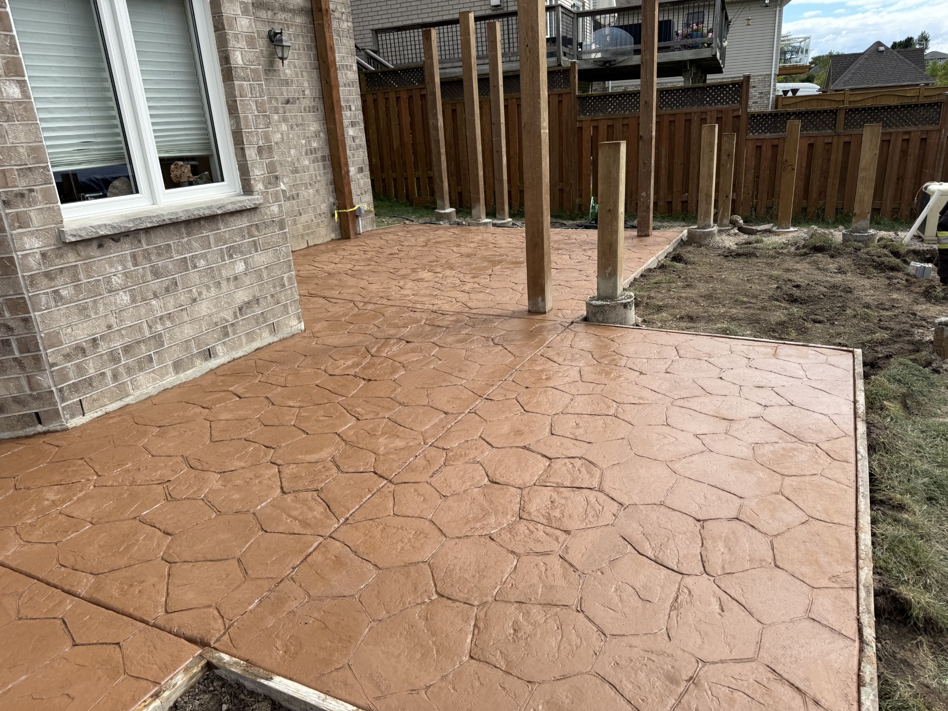 Custom concrete driveway with modern finish by Moussa Concrete in London Ontario